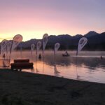 Calm lake with flags, the start line of the race.