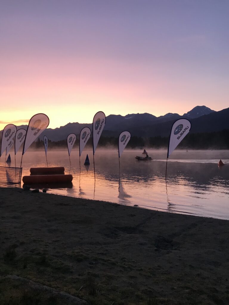 Calm lake with flags, the start line of the race.