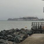 Alcatraz Island through rough water in the distance.